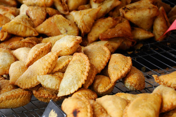Curry puffs for sale. It is one of the traditional cakes in Malaysia. Skin made from the wheat flour mixture and the inside is potato and curry mixture.