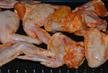Homemade food grilled chicken wings in sauce