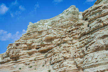 A fresh spring wind drives the waves to the coast of Cyprus. The Mediterranean Sea is painted with dark ultramarine and a luminous azure from the inside.     