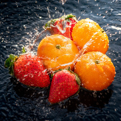 Fresh fruits splashing water