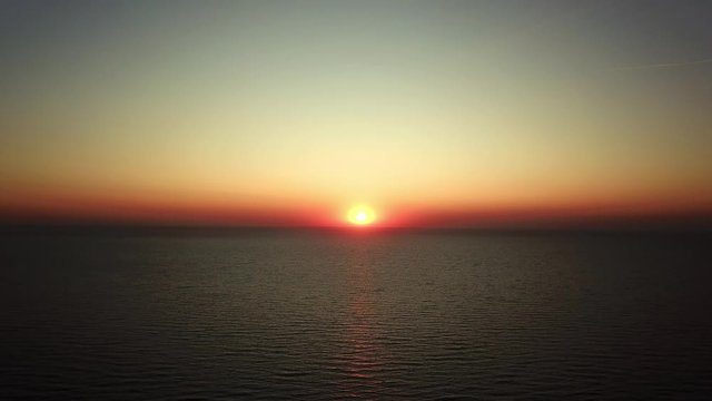 aerial view of Sunrise over sea, Beautiful sunrise Ocean, morning wawes on the sea, Beautiful reflections on water surface at sunrise, Sunrise above sea 