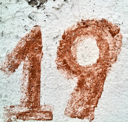 number nineteen on old wall