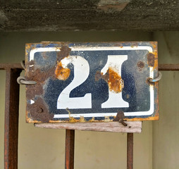 number 21 on old metal door