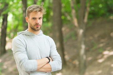 Naklejka na ściany i meble Confident and physically fit. Confident athlete keep arms crossed outdoors. Confident look of muscular man. Athletic type. Confident and healthy. Sports training and workout. Make yourself proud