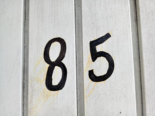 number 85 on a wall