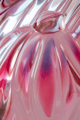 Abstract texture of colored rippled glass