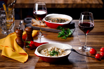 red wine and  dumplings the table