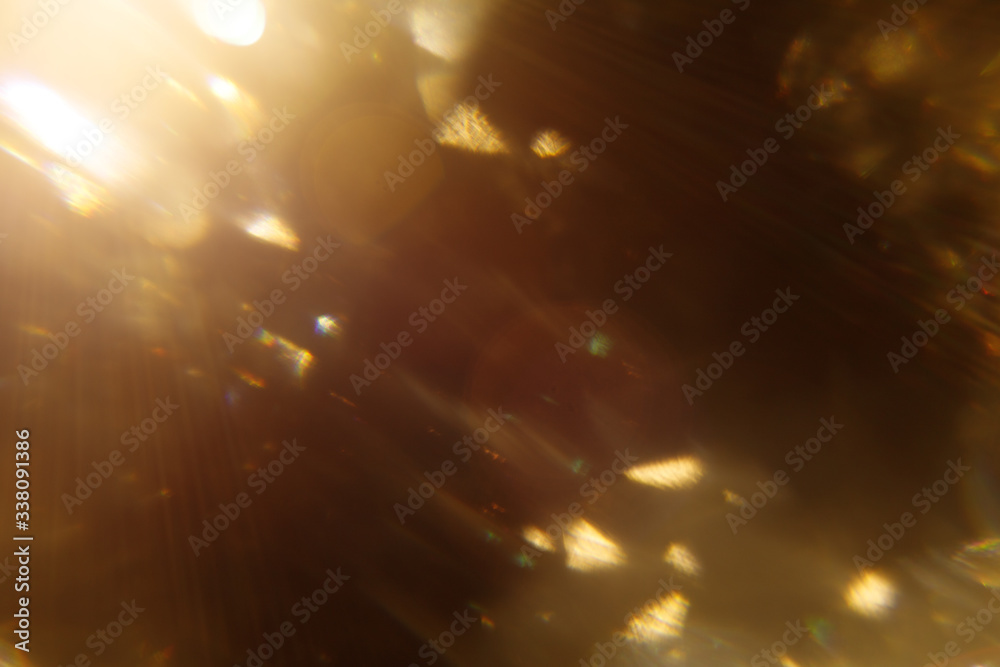 Poster Easy to add lens flare effects for overlay designs or screen blending mode to make high-quality images. Abstract sun burst, digital flare, iridescent glare over black background. Defocused bokeh.