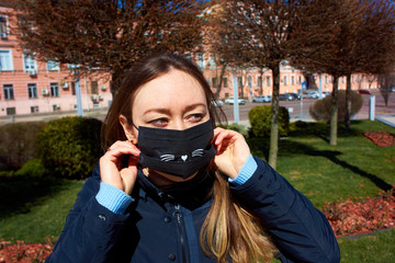 girl puts on a mask