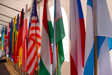 Background from flags of different countries, arranged in a row diagonally