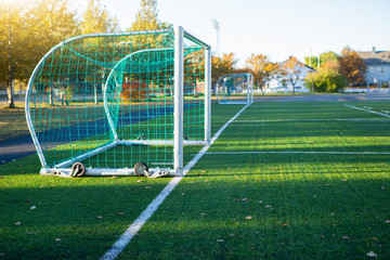 Football goal on the green field. 