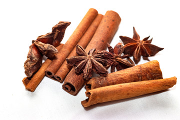 Star anise (Illicium verum) and cinnamon sticks (Canehl) close-up isolated on a light background