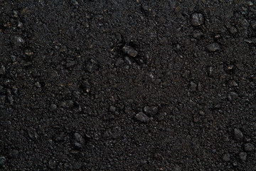 The texture of black freshly laid asphalt. Bitum, asphalt, top view.