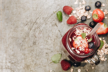 Berry smoothie on rustic background, copy space