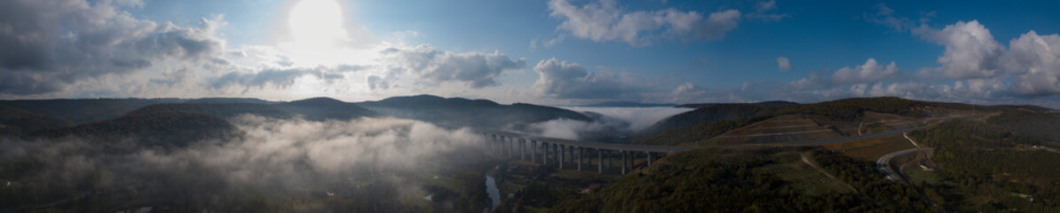 Fototapeta na wymiar a mystical highway viaduct immersed in fog