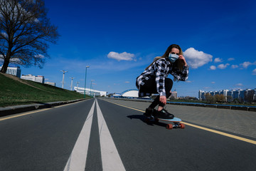 Portrait of a teenage in a medical mask with logboard during the quarantine period