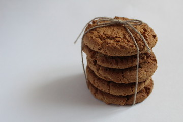 several stacks of homemade cookies are stacked on top of each other on a white light gray...