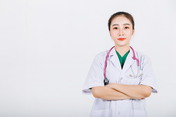 Portrait of young confident woman wearing surgical gown with isolated white wall background. Healthcare worker and Medical concept.
