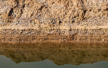 Layers of shingle and silt at a gravel pit