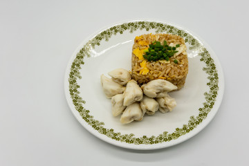Fried rice with egg along with premium lump crab meat and topped with chopped spring onion. Favorite Thai seafood dish isolated on white