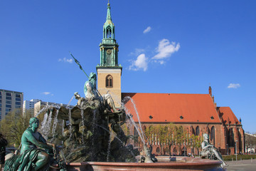 Neptune fountain with the St. Mary's Church in the background, Berlin - Germany