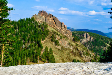 forest, rocky mountains and blue sky