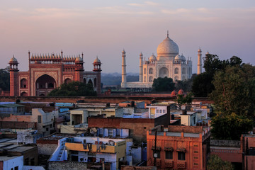Fototapeta na wymiar Rooftops of Taj Ganj neighborhood and Taj Mahal in Agra, India