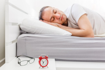 Coronavirus Quarantine Lifestyle. Man Sleeping Lying In Bed At Home During Pandemic Self-Isolation....