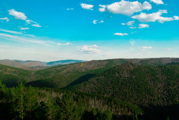 Fototapeta na wymiar forest, rocky mountains and blue sky
