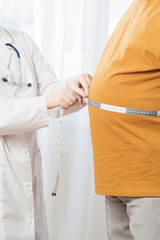 doctor measures  man measures  waist