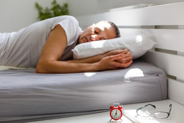 Coronavirus Quarantine Lifestyle. Man Sleeping Lying In Bed At Home During Pandemic Self-Isolation. Panorama