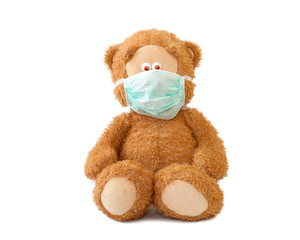 teddy bear with medical mask isolated on white bacground