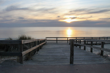 Fototapeta na wymiar Atlantic ocean sunset in wooden pontoon Lacanau sea beach in gironde France