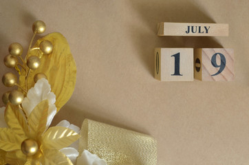July 19, Vintage natural calendar design with number cube.