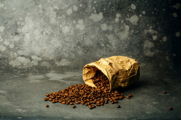 Coffee background. Roasted coffee beans on a dark background. Coffee banner for menu, design and decoration