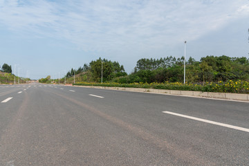 Fototapeta na wymiar Low angle perspective view of wide asphalt road street