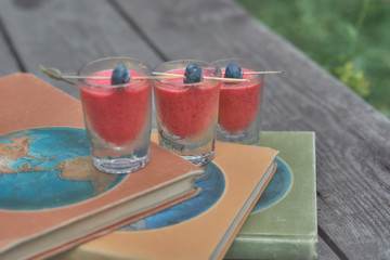 alcoholic shots with skewers with berries
