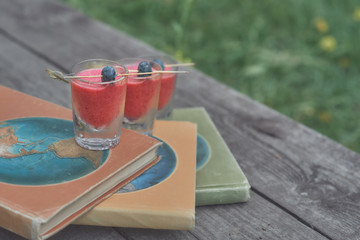 alcoholic shots with skewers with berries