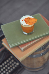 alcoholic cocktail with fruits on an old wooden table