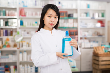 Chinese fine pharmacist posing in medical shop