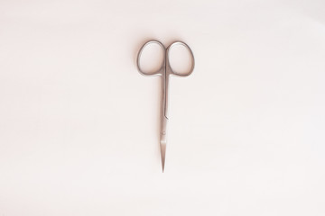 manicure scissors on a white background. minimalism concept. Mock up, space text