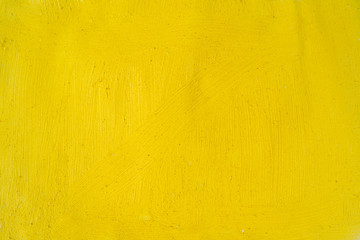 A beautiful Yellow paint texture on wall, background - Image. Color paint strokes.