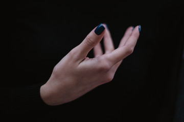 Beautiful female hand with long 