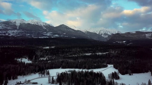 The beautiful Bugaboo Mountain Range near a small, peaceful town of Golden BC during sunrise - aerial