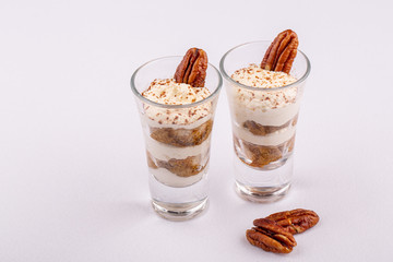 Tiramisu with whipped cream and pecan nut