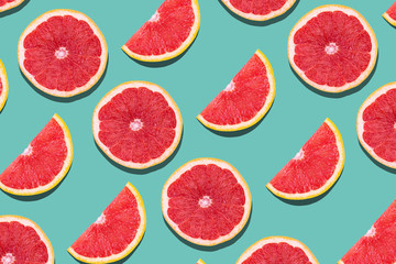 Seamless pattern with juicy kiwi and greapfruit on light blue background