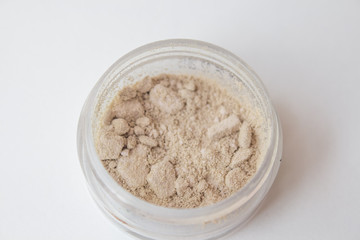 Texture of makeup powder - blush or eyeshadow. Mineral make-up cosmetics close-up isolated on white background