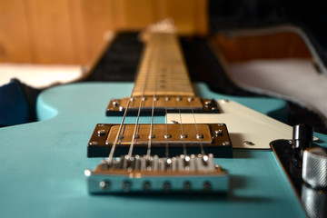 Fototapeta na wymiar A light blue electric guitar