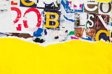 Torn yellow paper poster on collage from clippings with letters and numbers texture background....