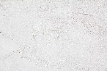 White plaster painted wall with rough grungy surface texture background.